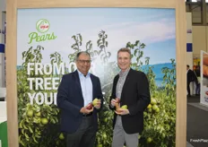 Sumit Saran and Kevin Moffitt with USA Pears show different pear varieties from the Pacific Northwest.